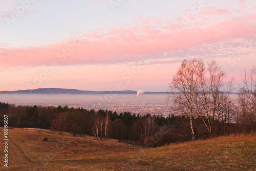 Fototapeta Naklejka Na Ścianę i Meble -  Amazing winter sunrise over city Ceske Budejovice and hill Klet, Czech landscape