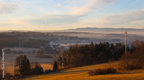 Misty morning winter sunrise on Czech countryside with fog