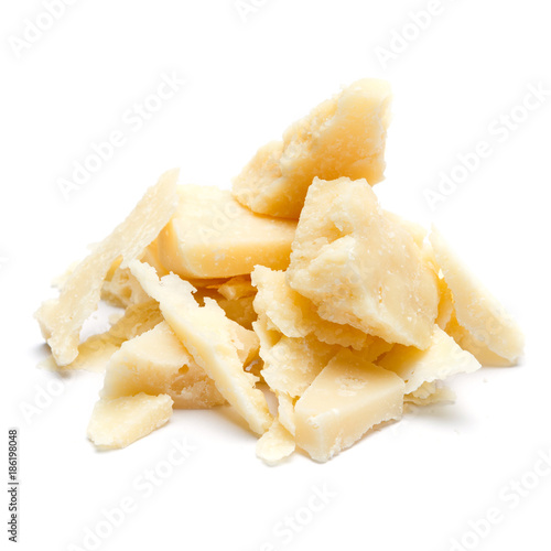 Small pieces of parmesan cheese on white background
