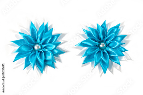 White and blue handmade hair clips for girls on a white background