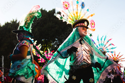 mexican dancers showcasing their traditional folk costumes rich in color huehues in Mexico photo