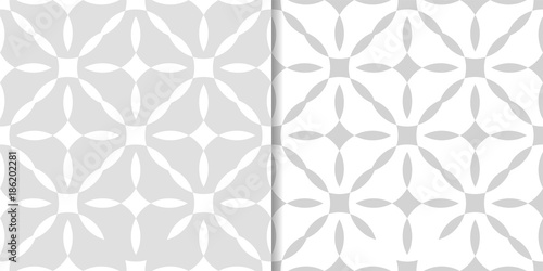 Light gray geometric ornaments. Set of seamless patterns