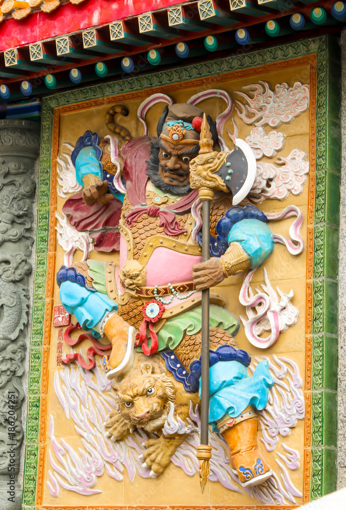 colorful low relief of god warrior in Sik Sik Yuen Wong Tai Sin Temple,Hongkong