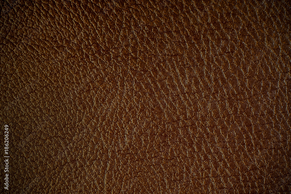 Texture of artificial leather. Dark brown background. Texture of artificial leather. Dark brown background.