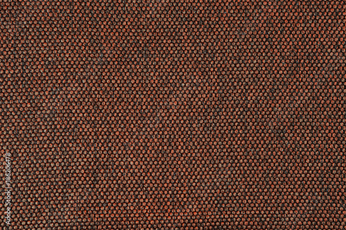 Texture of jacquard. Brown background.