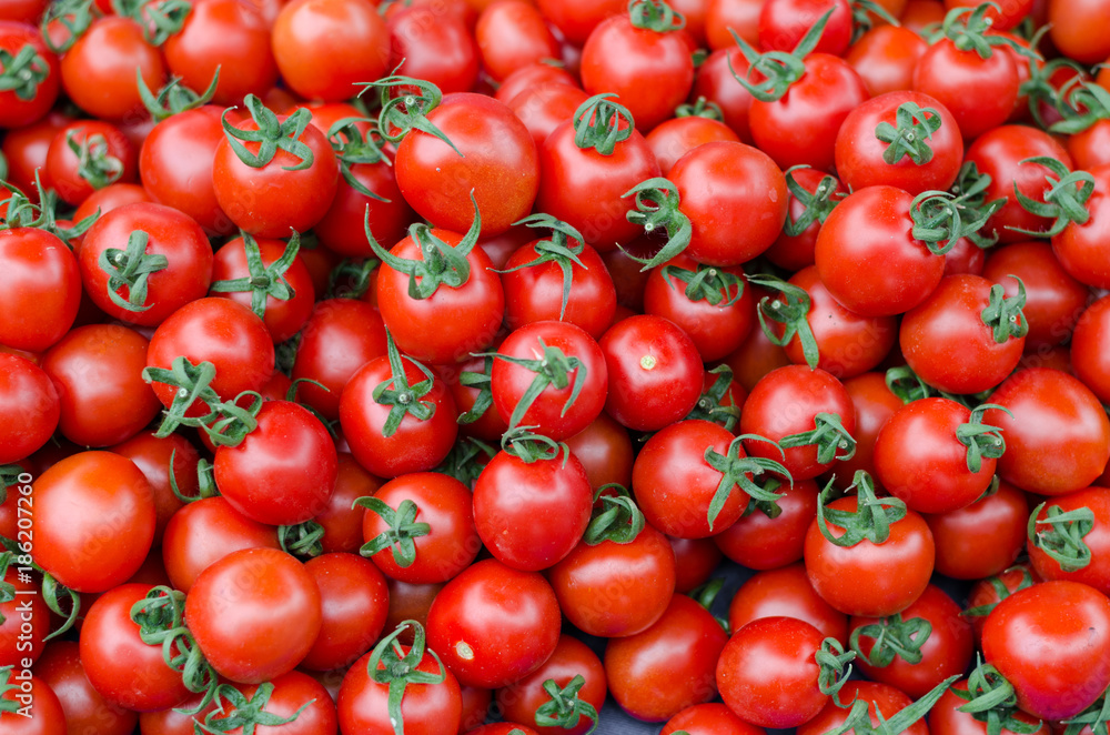Organic Tomatoes background top view on market Organic Tomatoes background top view on market