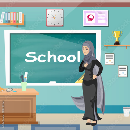 Muslim teacher, professor standing in front of blackboard