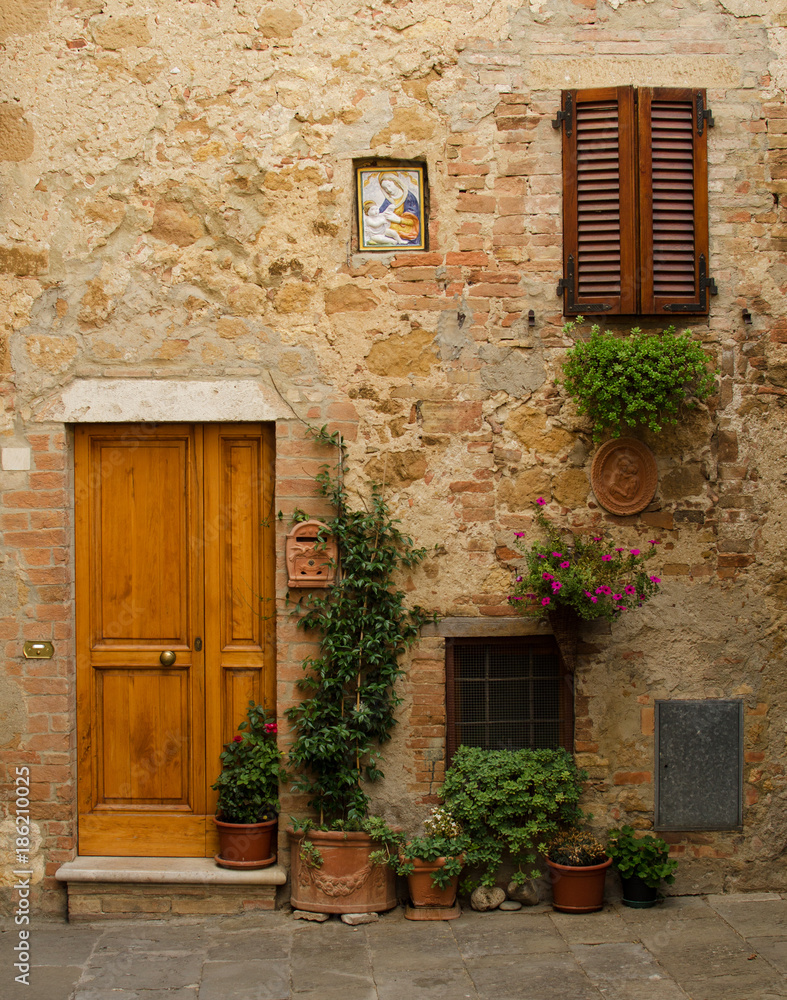 Facade of old house in Pienza.