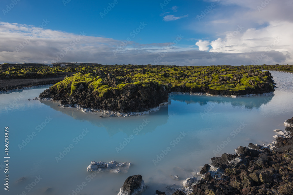 A blue lagoon surrounded by moss in Iceland 