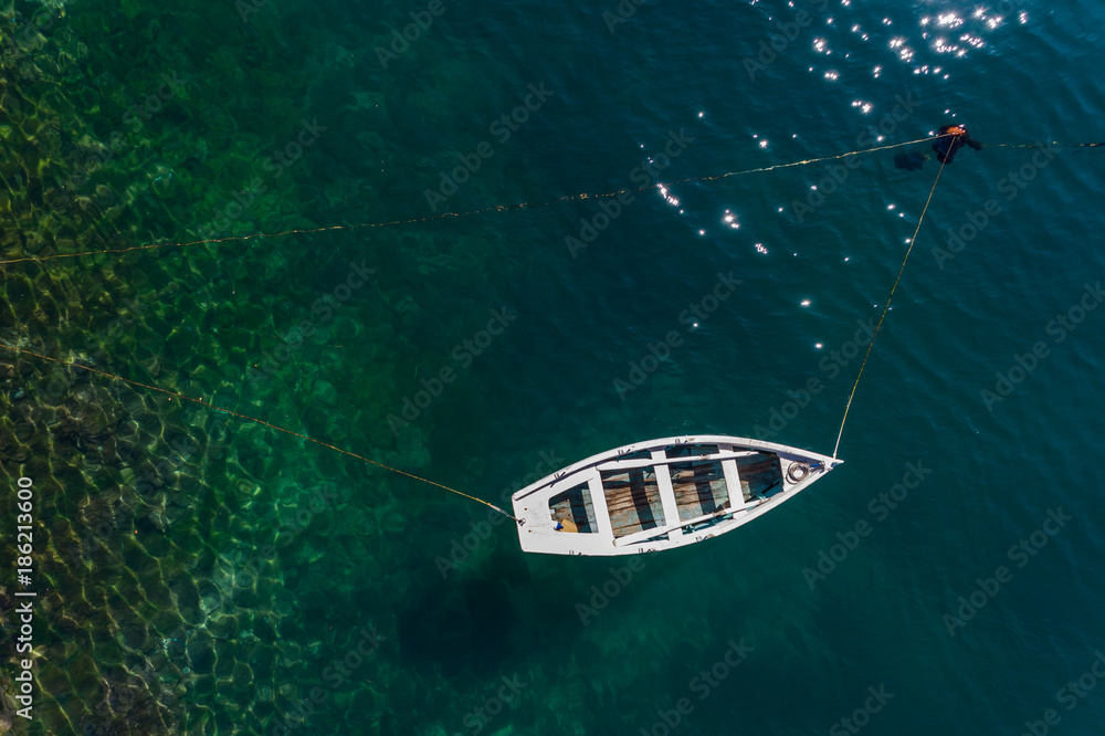 Aerial view from the top to the fishing boat. Montenegro.