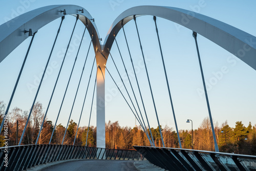 Small bridge in the morning with blue sky as background © Pekka Vainio