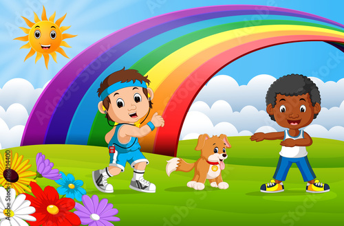 Children sport and dog in the park on rainbow day 