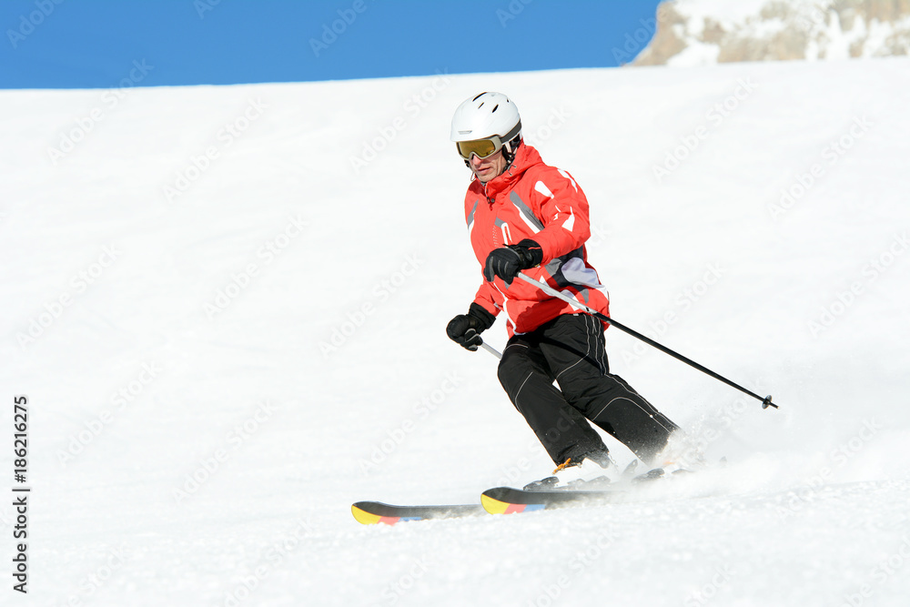 Skier on the mountain slope in Dolomites, Italy, Europe.