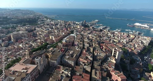 CAGLIARI, SARDINIA, ITALY  – JULY 2016 : Aerial shot over Cagliari cityscape on a beautiful day with view of harbour and city centre photo