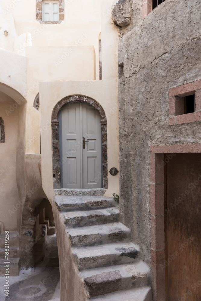 Stairs and door in the old traditional village of Emporio, Santorini, Greece