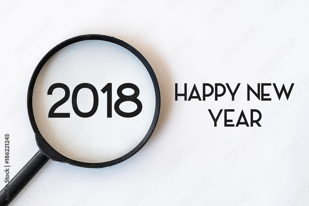 2018 word in Magnifying Glass isolated with whte background