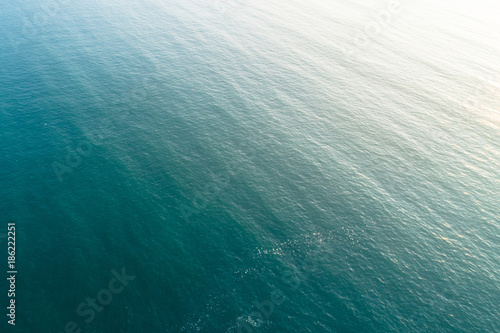 aerial drone view of seascape under sunrise as a background