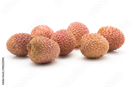 Lychee isolated on white background ripe pink fresh berries.