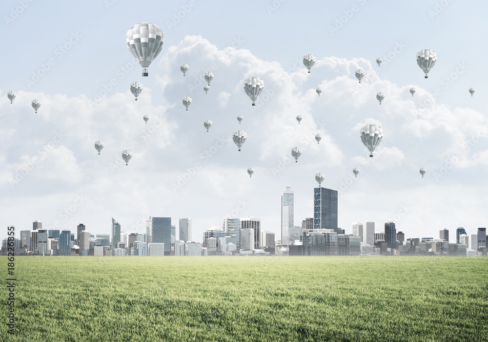 Concept of eco green life with aerostats flying above city