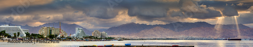 Panoramic view on the central public beach of Eilat city and northern shore of the Red Sea  photo