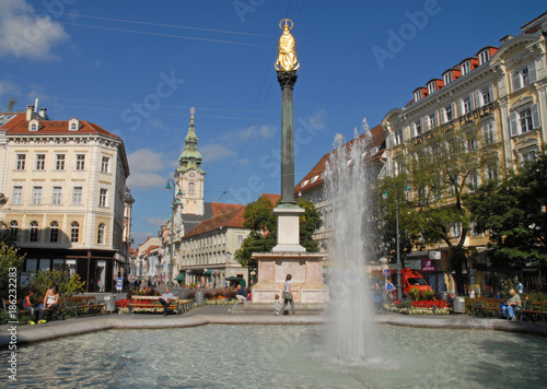 Graz, Austria - September 28, 2014: Square Eiserne Tor, Mariensäule, Franciscus church and Herrenstreet photo