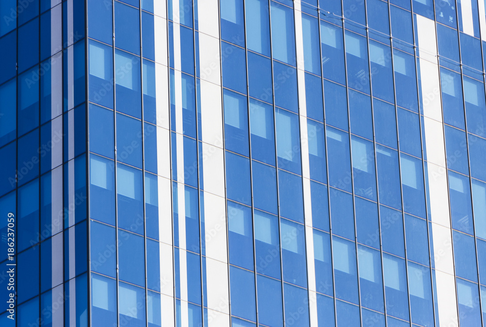 Clouds Reflected in Windows of Modern Office Building