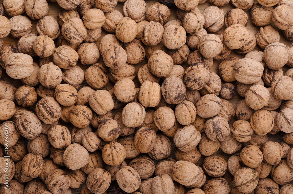 Walnut. Whole walnuts on wooden table. Natural and healthy food. Walnut. Whole walnuts on wooden table. Natural and healthy food.
