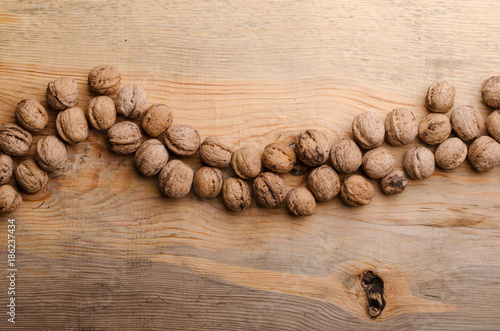 Walnut. Whole walnuts on wooden table. Natural and healthy food.