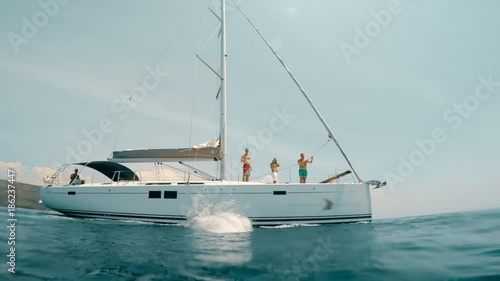Tourist man jumped in water from yacht.