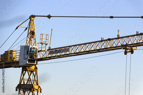 Wallpaper Mural yellow industrial construction crane against blue sky Torontodigital.ca