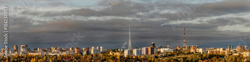 Panorama of the city of Perm early in the morning: houses, gardens, modern high-rise buildings and the TV tower © Alexander