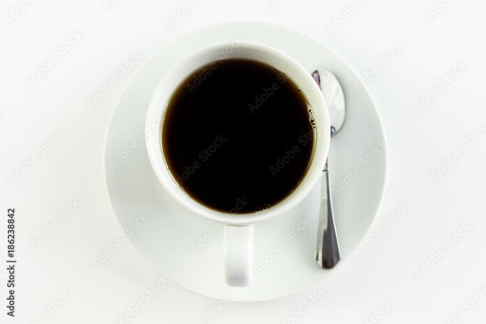 Top view close up of a cup of coffee, on white table Top view close up of a cup of coffee, on white table