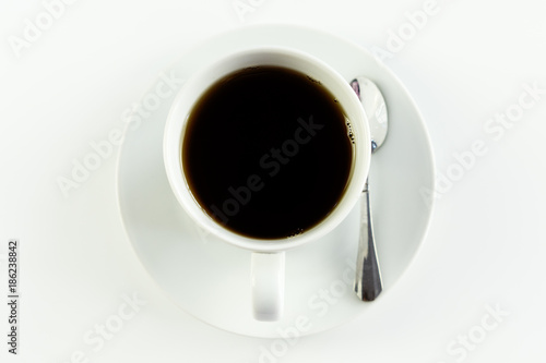 Top view close up of a cup of coffee, on white table