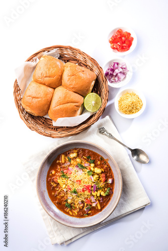 Misal Pav or misalpav, Misal Pav with Farsan. Traditional Indian spicy dish made with moth beans (match) and served with farina and bread
