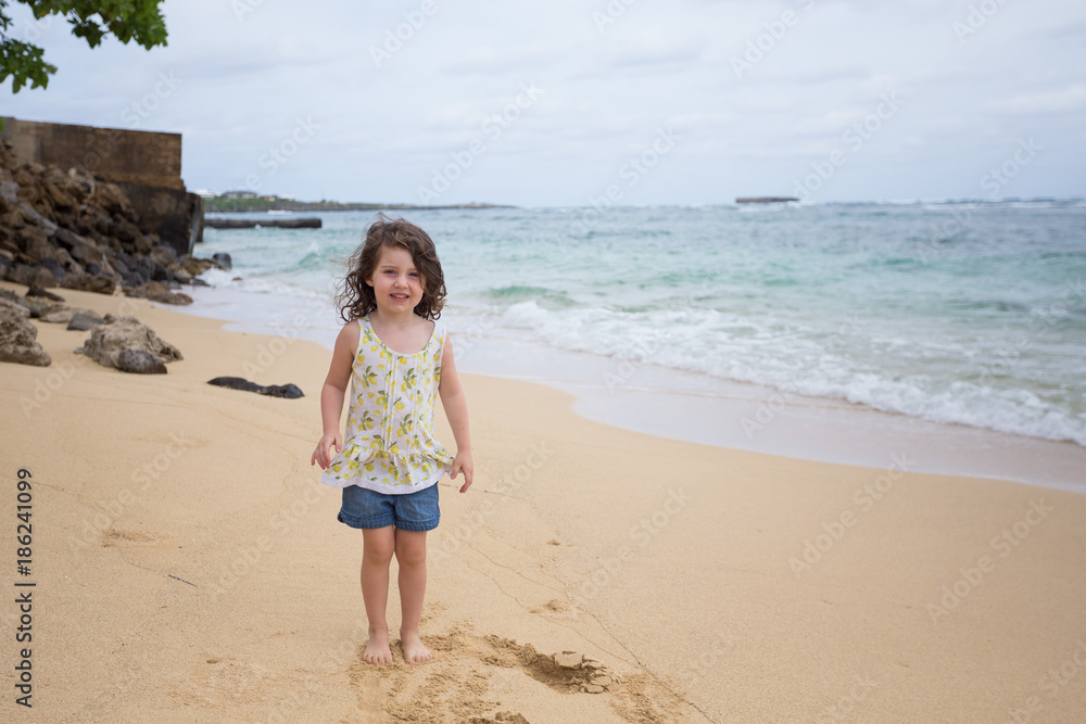 Child Playing on Beach in Oahu Hawaii