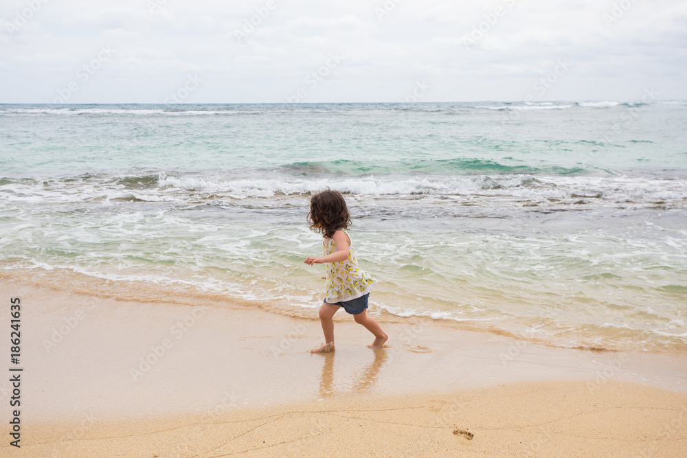 Child Playing on Beach in Oahu Hawaii