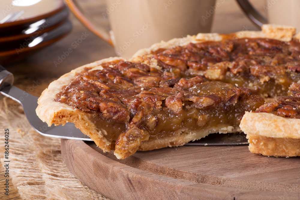 Slice of Pecan Pie on a Wooden Platter Slice of Pecan Pie on a Wooden Platter