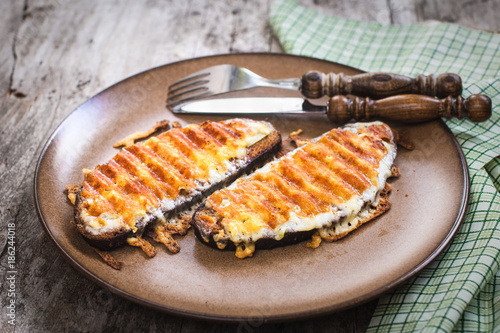Tableau sur toile Grilled cheese sandwich, welsh rarebit, selective focus, top view