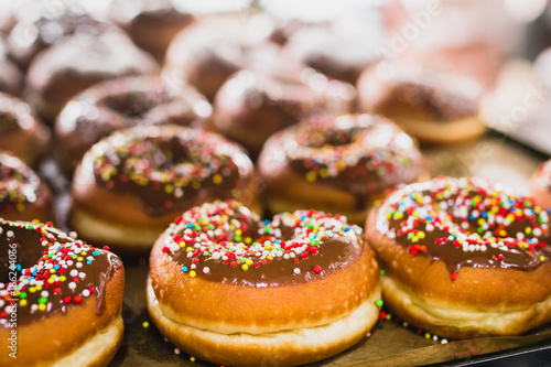 Donuts / traditional jewish pastry for Chanukah / Ḥanukah, selective focus