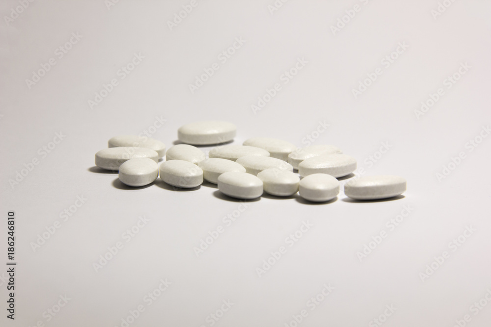 Vitamins of calcium in pills isolated on white background. Copy space for text. Vitamins of calcium in pills isolated on white background. Copy space for text.
