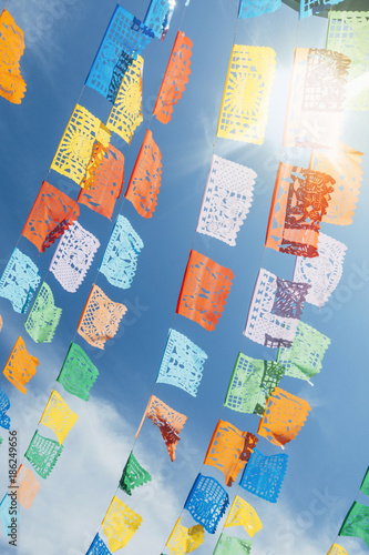 Colorful Mexican flag decorations in sunshine 