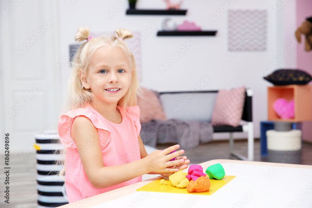Cute little girl modeling from playdough at home Cute little girl modeling from playdough at home
