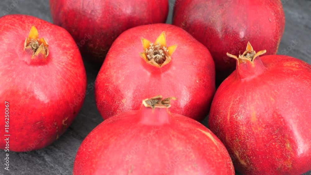 Rotating whole pomegranate fruits, top view, 4K. Rotating whole pomegranate fruits, top view, 4K.