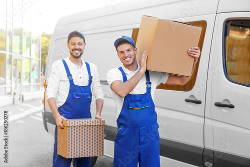 Delivery men with moving bo...