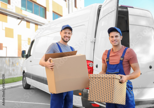 Delivery men with moving bo...