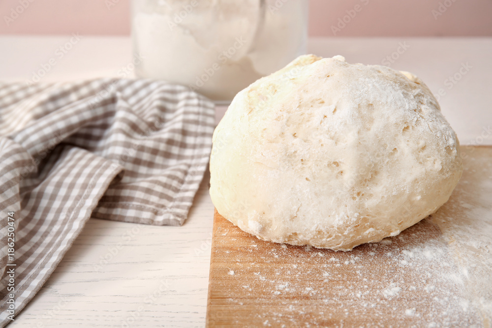 Raw puff pastry on wooden board Raw puff pastry on wooden board