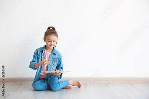 Little girl with watercolor...