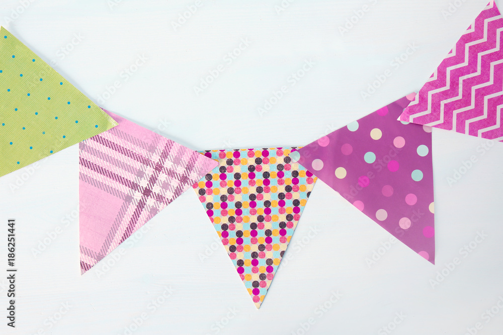 Fototapeta premium Handmade colorful garland on light background