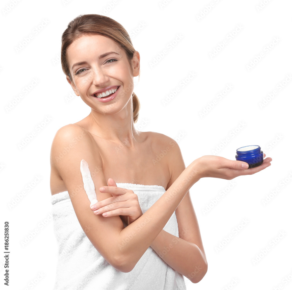 Young woman applying body cream on white background Young woman applying body cream on white background
