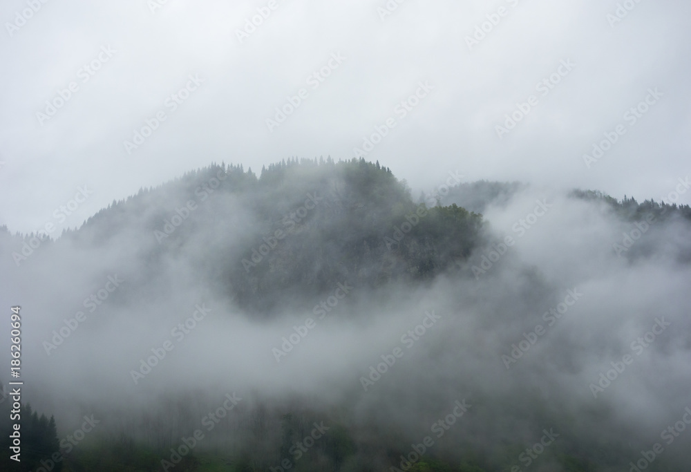 Dense fog covering mountain in Norway.